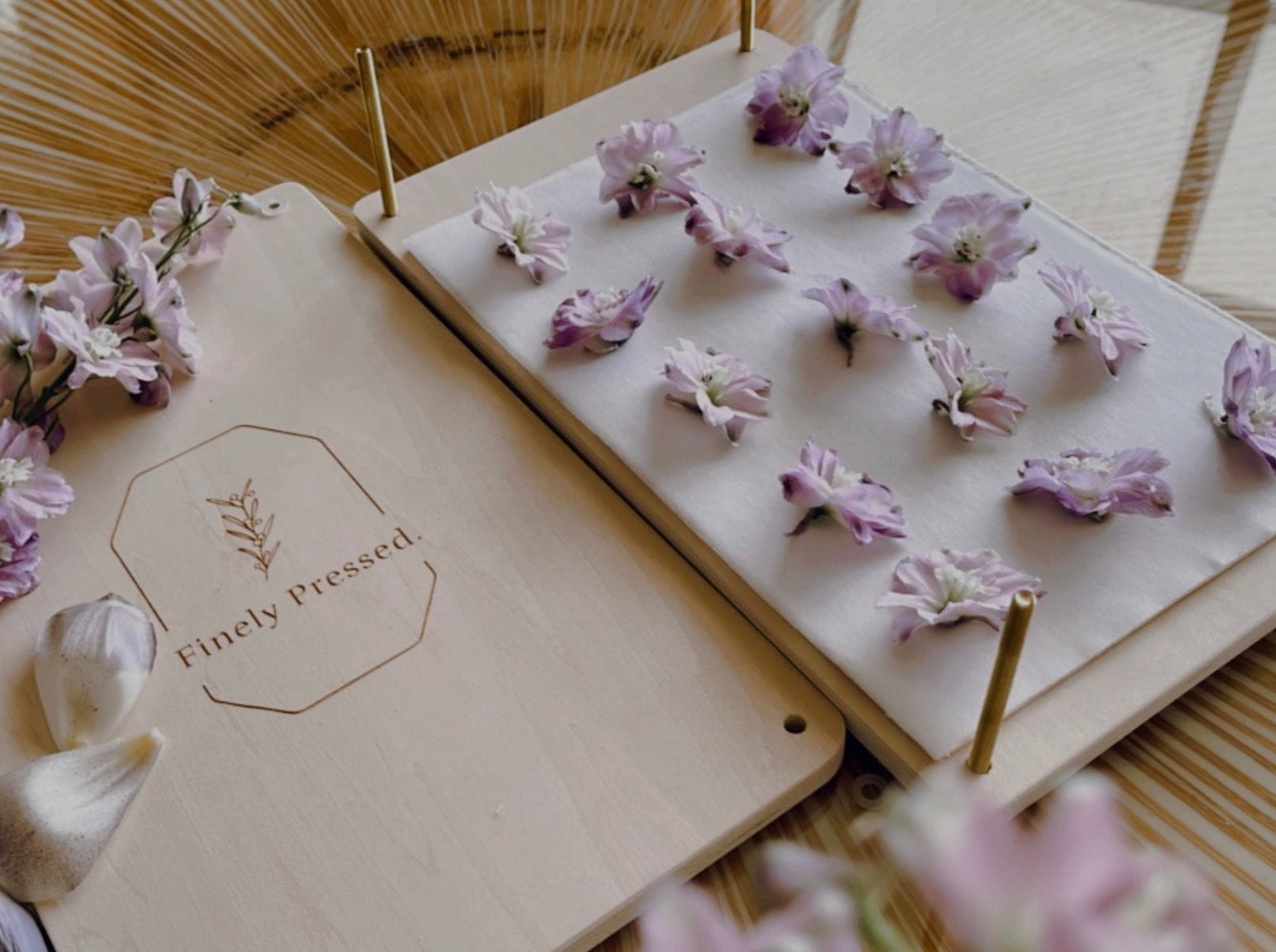 Finely Pressed wooden flower press with purple flowers