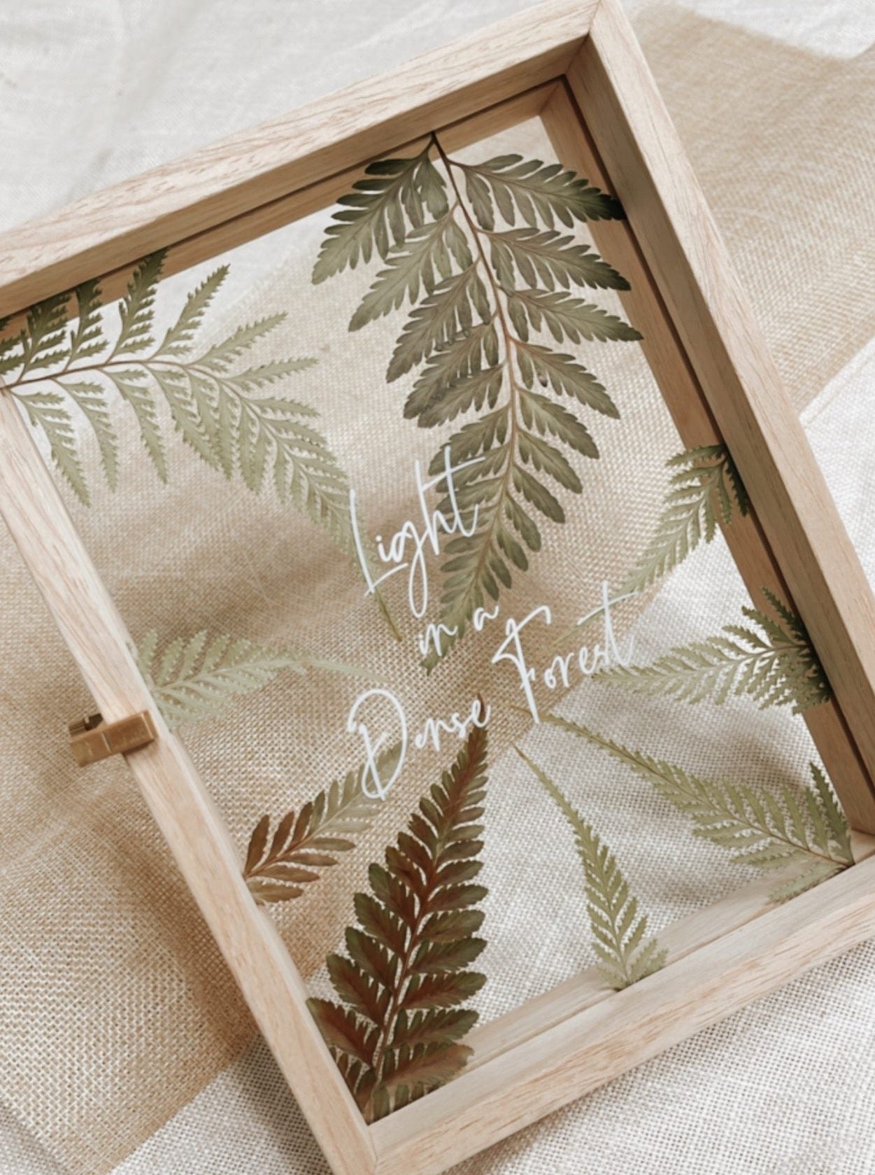 Pressed flowers in custom design, framed in wooden frame